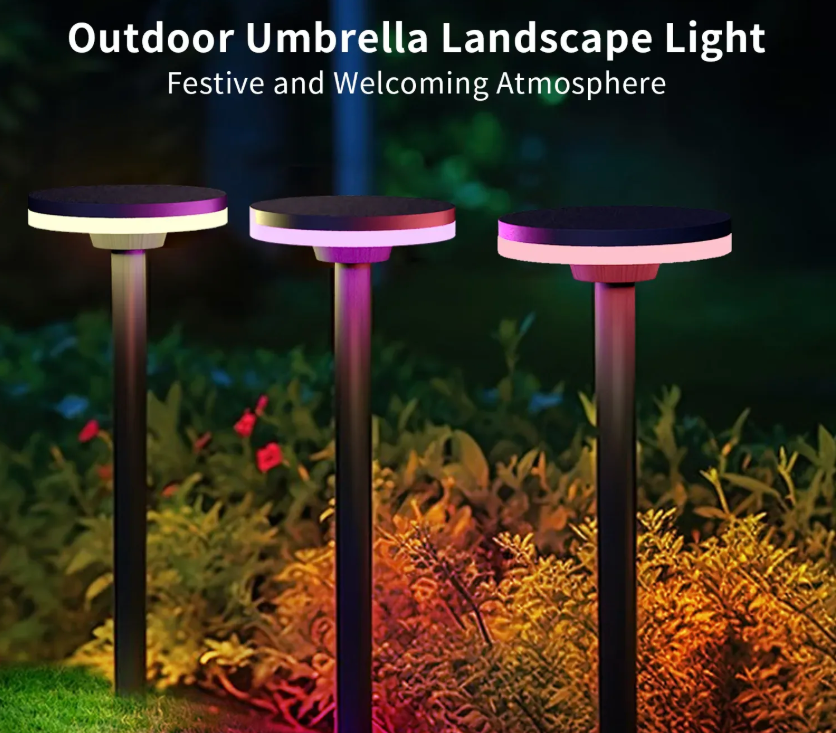 Outdoor Umbrella Landscape Light — three stake lights in a garden at night with festive pink and warm white glow